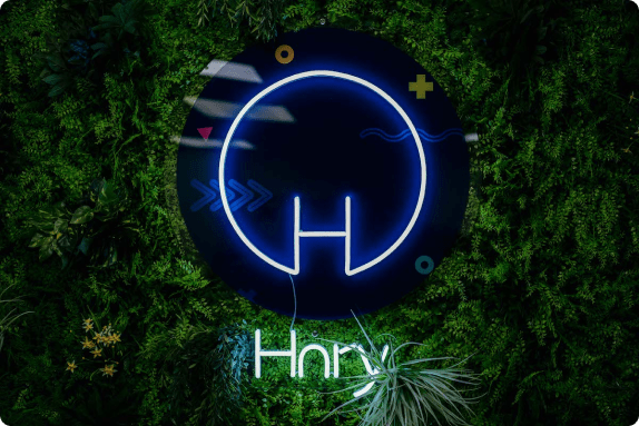 Image of Hnry's logo being displayed on a featured plants wall
